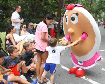 Susie Pancake greets children at the Kensington Labor Day Parade. 